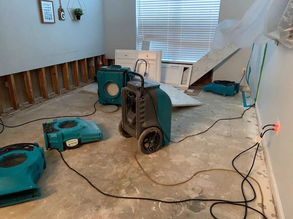 Dehumidifier in flood-cut room for Water Damage Restoration in Granite City